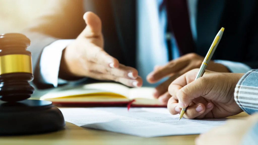 a cruise ship injury lawyer explaining the role of customs on a cruise to their client while signing documents