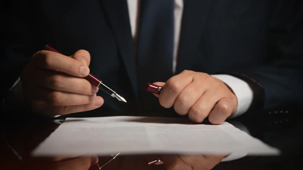 a cruise ship injury lawyer reviewing a document of cruise ship laws and regulations.