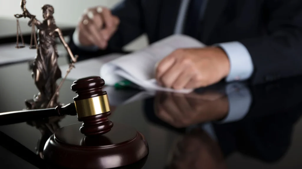 a cruise ship injury attorney reviewing case documents on his desk